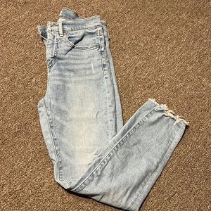 light wash lightly distressed skinny jeans